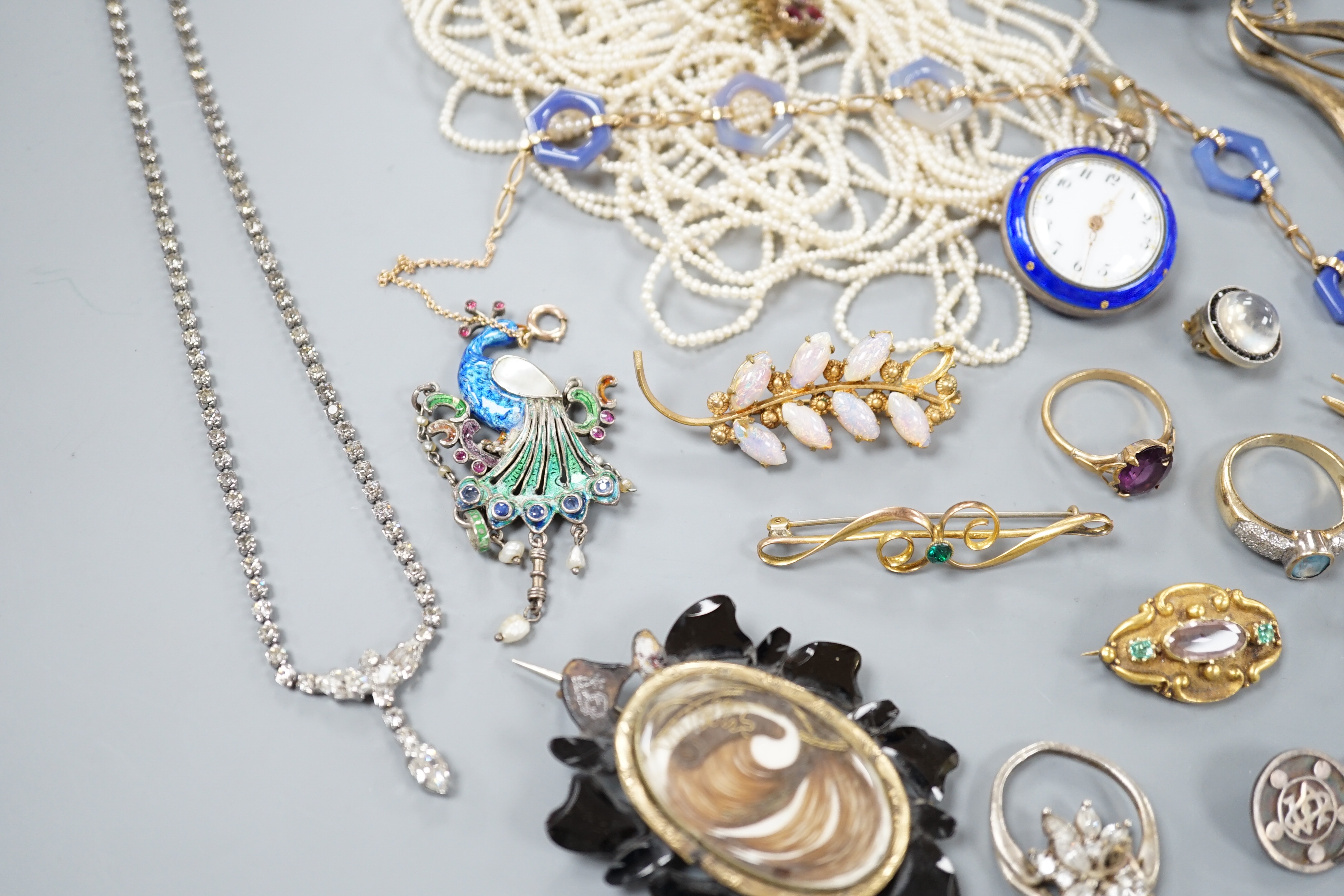 A quantity of mixed Victorian and later jewellery, including yellow metal and white opal scroll bar brooch, 18ct dress stud, 9ct and agate set necklace, seed pearl necklace(a.f.), enamelled peacock brooch, gem set Victor